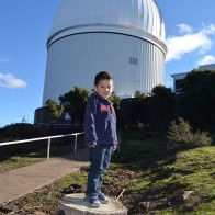 Levi posing next to Siding Spring Observatory